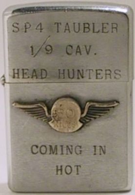 1971 Zippo with lid reading "SP4&nbsp;Taubler 1/9 Cav. - Head Hunters ".&nbsp;&nbsp;The case reads "Coming in Hot" and has an attached badge "50 kills".&nbsp;&nbsp;The 1st Squadron, 9th Cavalry served in combat operations in Vietnam from 1965 to 197…