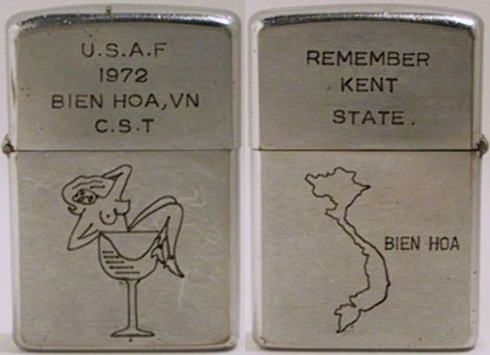 1972 Zippo reads "U.S.A.F. 1972 Bien , Vn C.S.T." (Combat Survival Training) and depicts a nude girl in a cocktail glass.&nbsp; The reverse says "Remember Kent State" and has a map of Vietnam